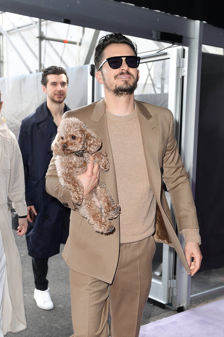 Orlando Bloom and his dog Mighty attend the Boss fashion show on February 23 in Milan, Italy.