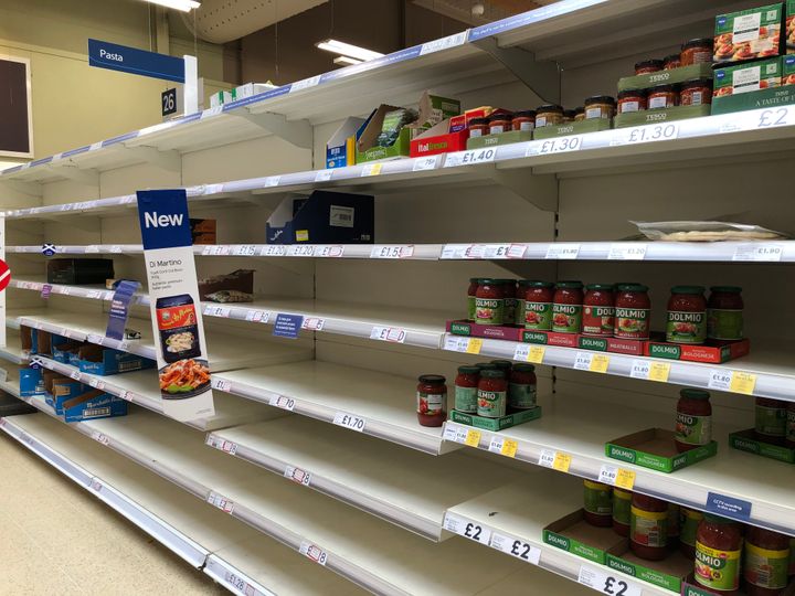 Shelves empty of pasta at Tesco in Camelon near Falkirk, as shoppers purchase supplies amid the coronavirus pandemic.