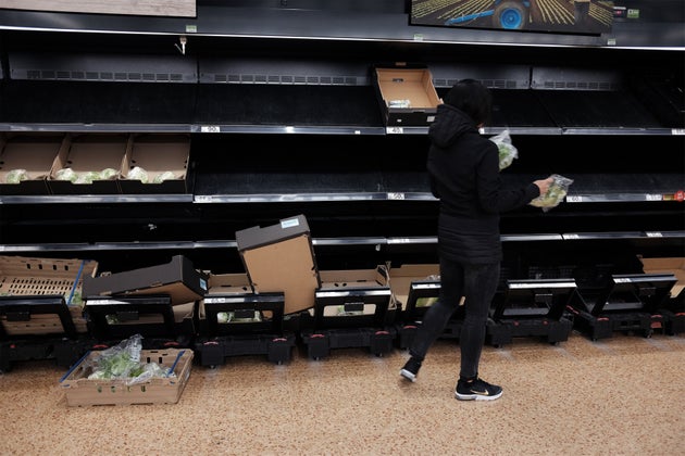 Empty shelves in the fruit and vegetable section of an Asda store in London.