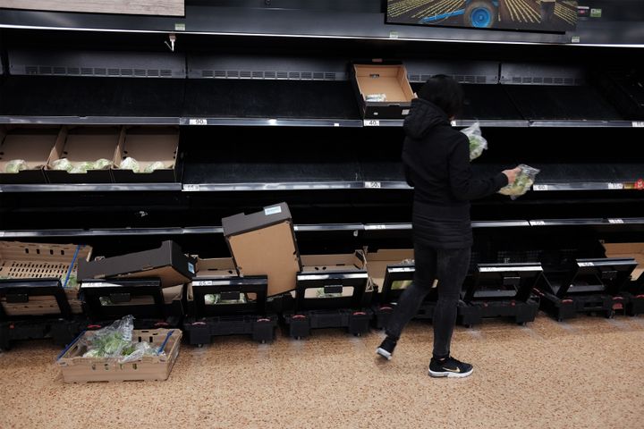 Empty shelves in the fruit and vegetable section of an Asda store in London.