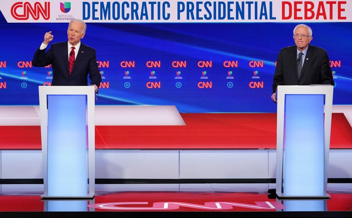 Former Vice President Joe Biden and Sen. Bernie Sanders (I-Vt.) stood 6 feet apart to limit spread of the coronavirus in a head-to-head debate in Washington on Sunday.