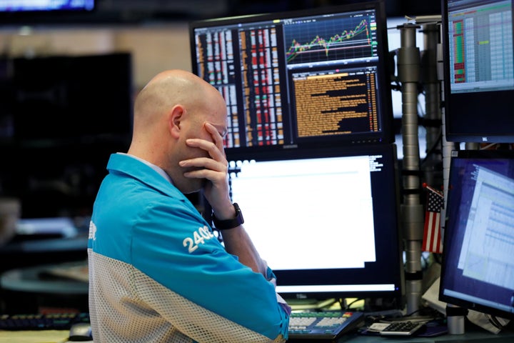 A trader reacts as he works on the floor of the New York Stock Exchange in New York City on March 11, 2020.
