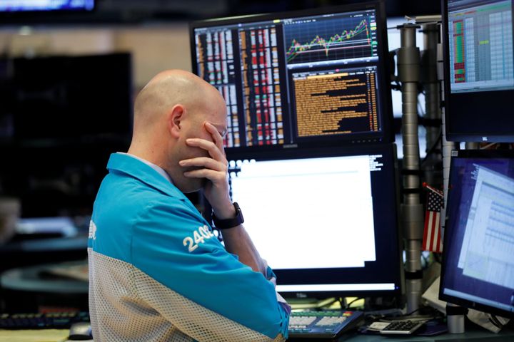 A trader reacts as he works on the floor of the New York Stock Exchange in New York City on March 11, 2020. 