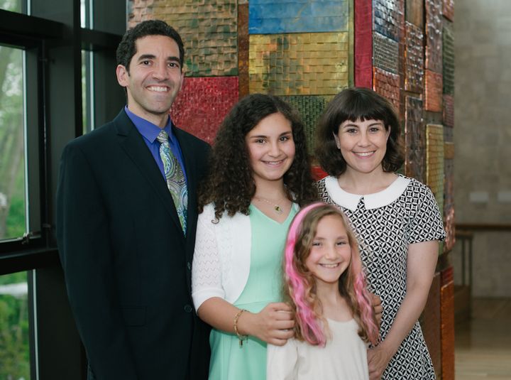 Debi Lewis with her husband, David, and daughters Ronni (back) and Sammi (front).