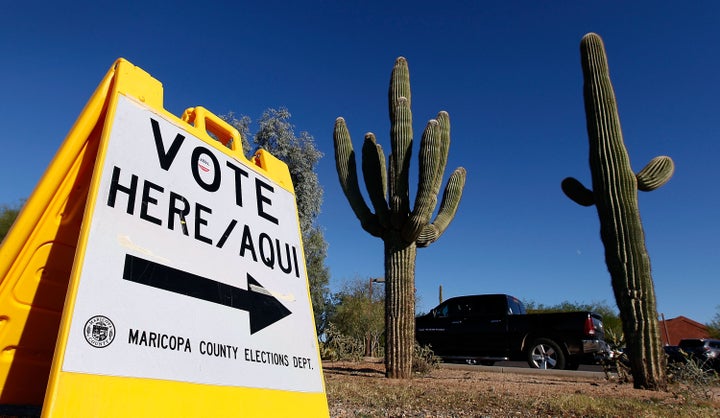 PHOENIX, AZ - NOVEMBER 08: A Maricopa County Elections Department sign directs voters to a polling station on November 8, 201