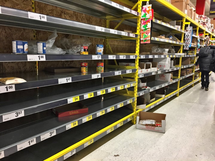 A grocery store with empty shelves in Toronto. As it becomes increasingly difficult to leave the house, community groups are stepping up to help care for the most vulnerable.