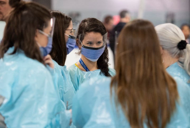 Medical staff prepare for the opening of the COVID-19 assessment centre in Ottawa on March 13, 2020. 