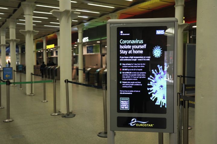 A coronavirus information sign at King's Cross railway station in London.