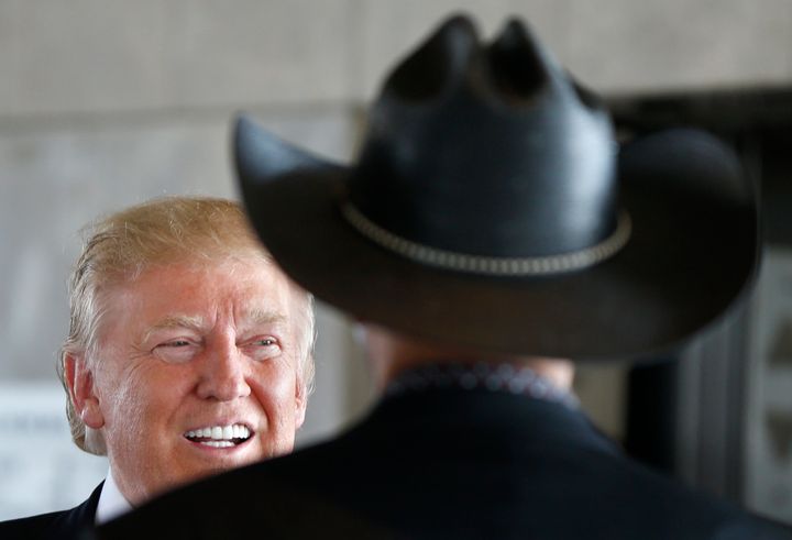 Donald Trump talks with with then-Milwaukee County Sheriff David Clarke during his presidential campaign in August 2016.