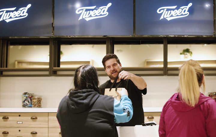 An employee packages product for a customer at the Tweed store in Portage la Prairie, Man on April 26, 2019. Canopy Growth has announced it is temporarily shutting all its Tweed and Tokyo Smoke locations due to the Covid-19 outbreak.