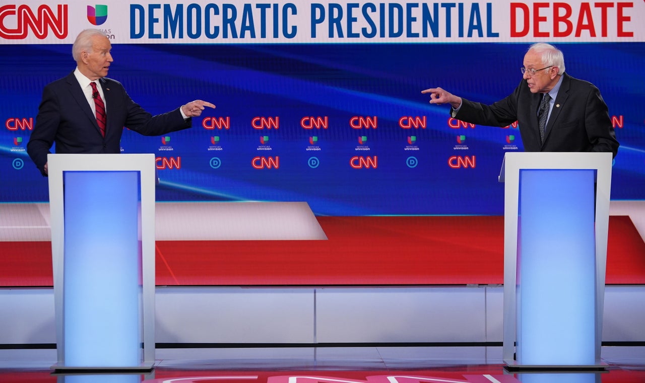 Democratic presidential hopefuls former Vice President Joe Biden (left) and Vermont Senator Bernie Sanders (right) take part in the 11th Democratic Party 2020 presidential debate in a CNN Washington Bureau studio in Washington, D.C. on March 15, 2020.