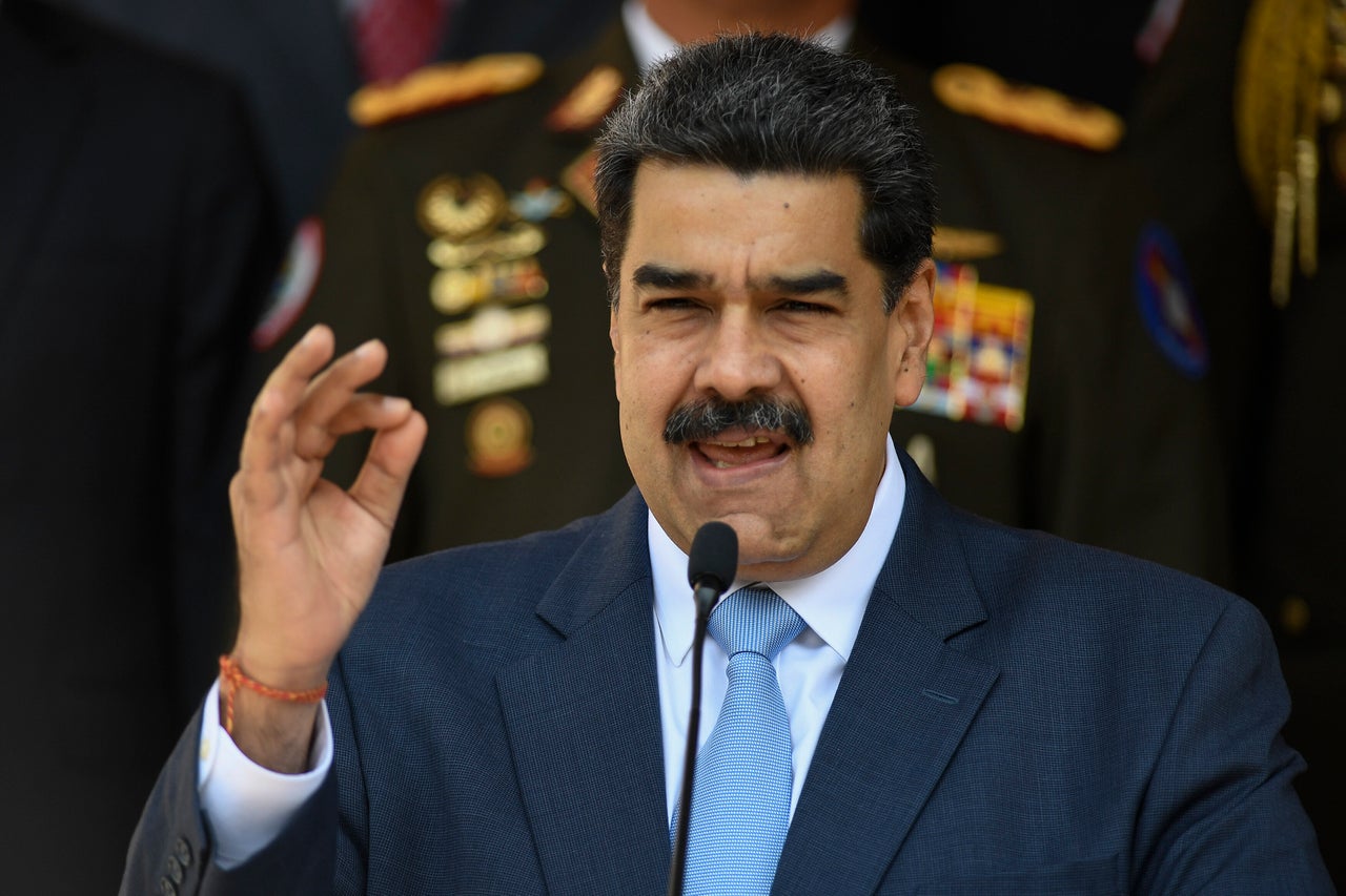 Venezuelan President Nicolas Maduro gives a press conference at the Miraflores Presidential Palace in Caracas, Venezuela, Thursday, March 12, 2020. Maduro has suspended flights to Europe and Colombia for a month, citing concerns for the new coronavirus. Maduro added in a national broadcast that the illness has not yet been detected in Venezuela, despite it being confirmed in each bordering country, including Colombia, Brazil and Guyana.