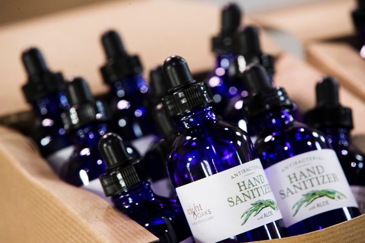 Bottles of hand sanitizer made at the Eight Oaks Farm Distillery in New Tripoli, Pennsylvania, are seen in a display box on Monday. The disinfectant will be donated to charitable groups that need hand sanitizer.