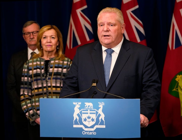 Ontario Premier Doug Ford makes an announcement declaring a state of emergency for the province in Toronto on Tuesday as Health Minister Christine Elliott and Dr. David Williams, the province's chief medical officer of health, look on.