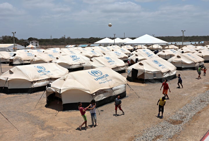 Venezuelan migrant children play soccer in a camp run by the UN refugee agency UNHCR in Maicao, Colombia.