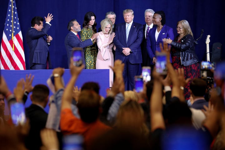 Guillermo Maldonado (left) and other evangelical leaders pray for President Donald Trump at an evangelical rally in Miami on Jan. 3, 2020.