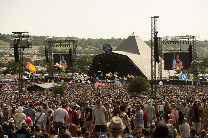 Festival-goers enjoy the fine weather on the third day of the Glastonbury Festival of Music and Performing Arts on Worthy Farm near the village of Pilton in Somerset, South West England, on June 28, 2019. (Photo by Oli SCARFF / AFP) (Photo credit should read OLI SCARFF/AFP via Getty Images)