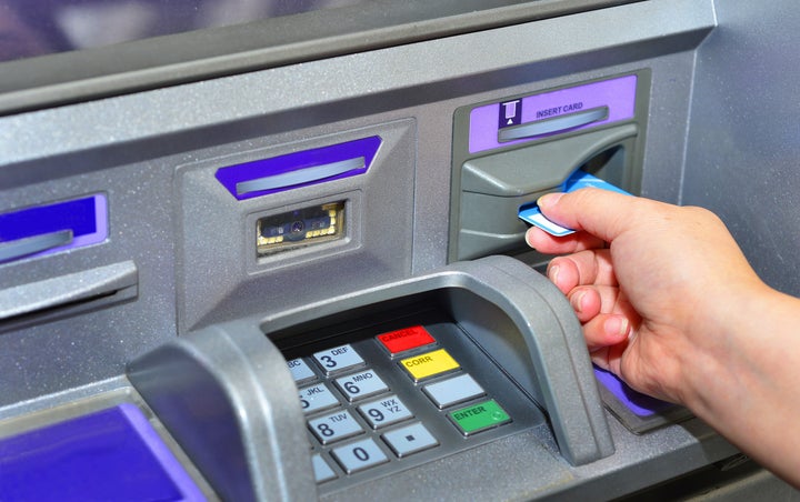 In this stock photo, a woman is seen using a bank machine. Canada's big banks say they will provide financial relief to customers impacted by the novel coronavirus.