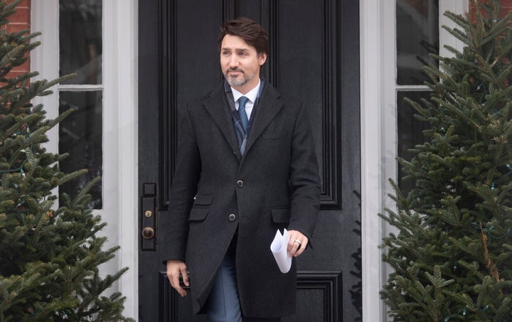 Prime Minister Justin Trudeau makes his way to the podium to speak with media about Canada's response to the COVID-19 virus in Ottawa, on March 17, 2020.