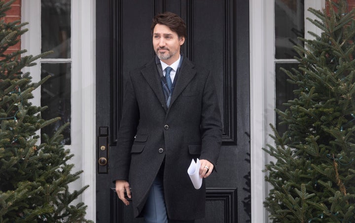 Prime Minister Justin Trudeau makes his way to the podium to speak with media about Canada's response to the COVID-19 virus in Ottawa, on March 17, 2020. 