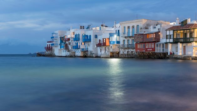 MYKONOS, GREECE - NOVEMBER 16: Mikri Venetia or Little Venice illuminated at night at Mykonos Town on...