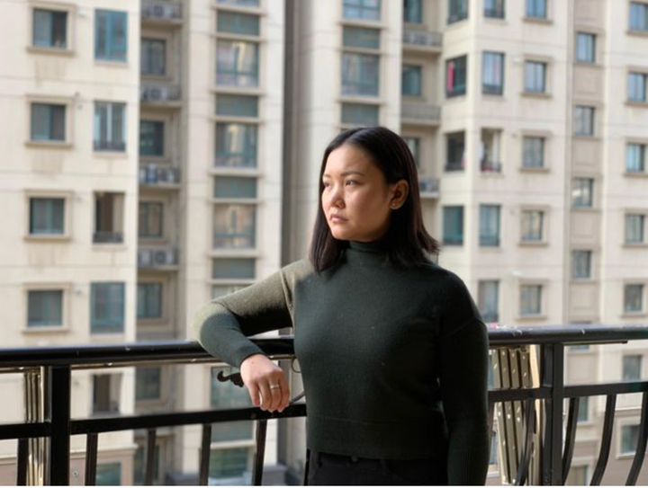 Debbie Lu on a balcony in Wuhan, China.