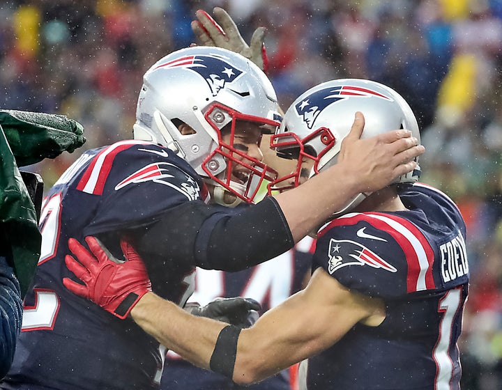 New England Patriots quarterback Tom Brady and Julian Edelman celebrated their 8-yard touchdown connection during an October