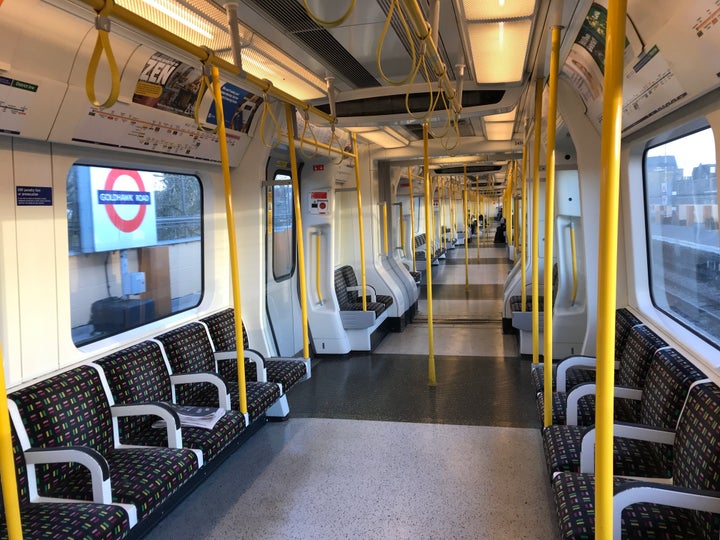 A sparsely-filled carriage on an underground train in west London.