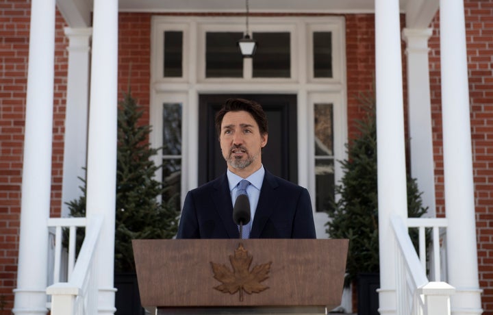 Prime Minister Justin Trudeau speaks during a news conference outside Rideau Cottage about the measures Canada is taking to combat the COVID-19 virus in Ottawa on March 18, 2020.