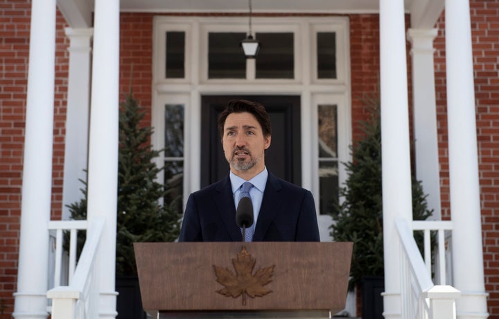 Prime Minister Justin Trudeau speaks during a news conference outside Rideau Cottage about the measures Canada is taking to combat the COVID-19 virus in Ottawa on March 18, 2020. 