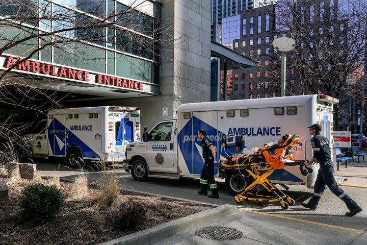 Paramedics transport a patient to the Toronto General Hospital on March 9, 2020.