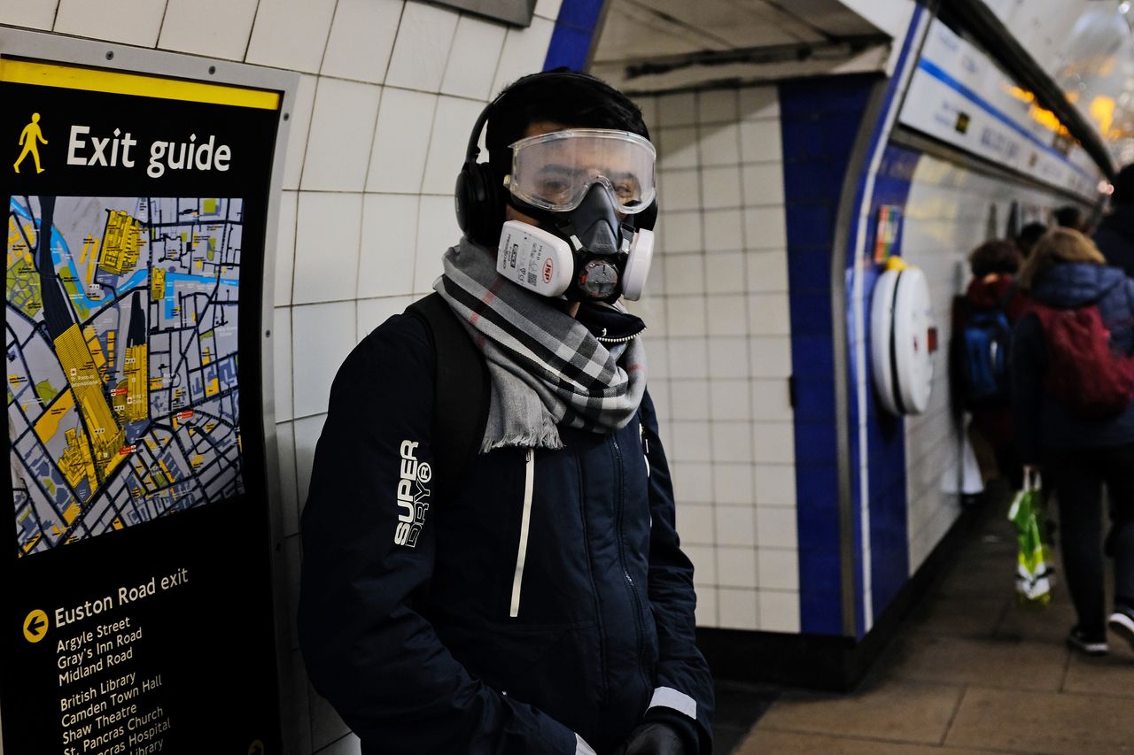 A person wearing a full face mask in King's Cross underground station in London after NHS England announced that the coronavirus death toll had reached 104 in the UK.