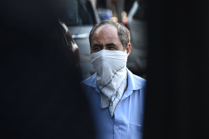 DELHI, INDIA, MARCH 19, 2020: A man wearing a hanky as a preventive measure against the COVID-19 coronavirus.