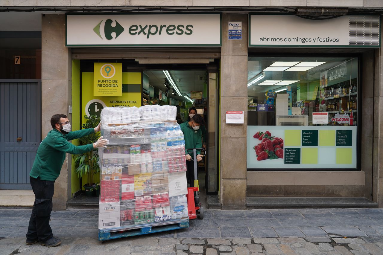 A supermarket worker in Seville, Spain.