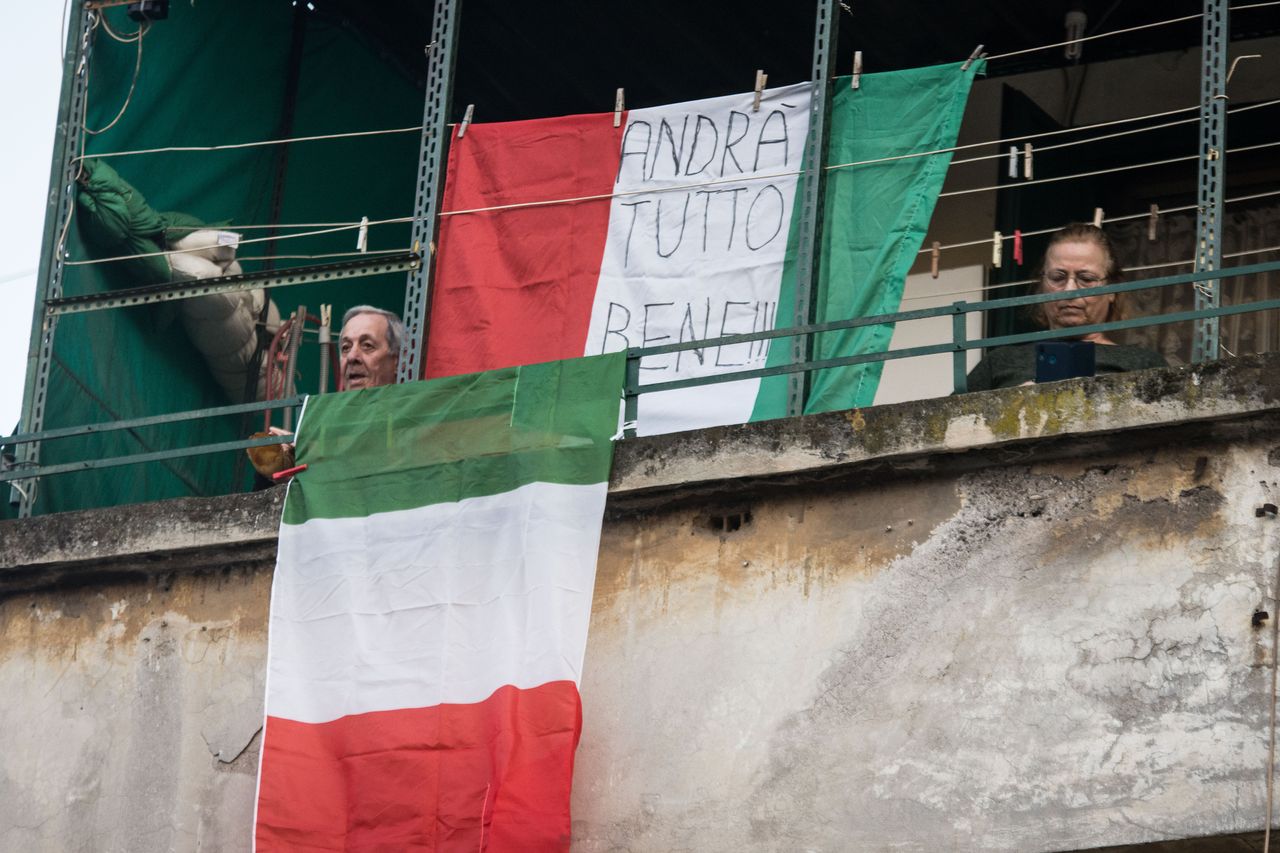 Residents on balconies in Rome.