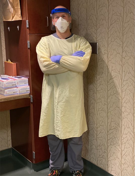 Andrew Gomez, a registered nurse at the Nebraska Biocontainment Unit, wears the personal protection equipment used when treating potential coronavirus patients.
