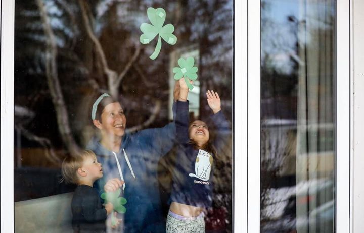 Photojournalist Leah Hennel caught a candid shot of HuffPost Canada editor Michelle Butterfield and her family prepping for their Calgary neighbourhood's scavenger hunt.