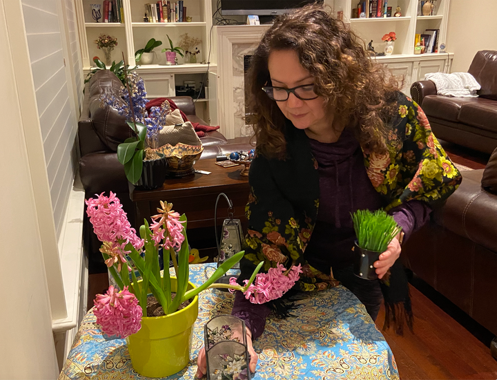 My mother getting our Haft-Sin ready for this year.
