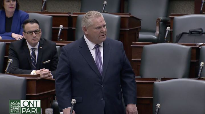 Ontario Premier Doug Ford addresses a near-empty legislature Thursday during an emergency session to pass two COVID-19 laws.