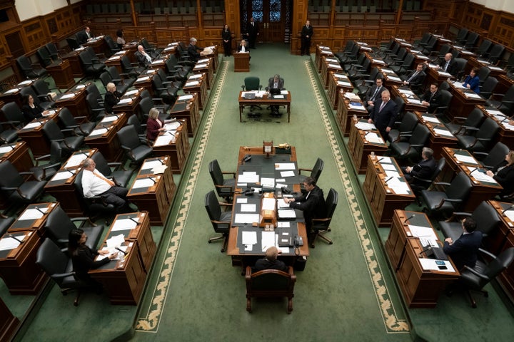 A skeleton crew of MPPs and staff attend an emergency session of Ontario's legislature on Thursday.