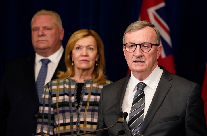 Dr. David Williams, Ontario's chief medical officer of health, speaks as Ontario Premier Doug Ford and Health Minister Christine Elliott look on at an announcement declaring a state of emergency, in Toronto on March 17, 2020.