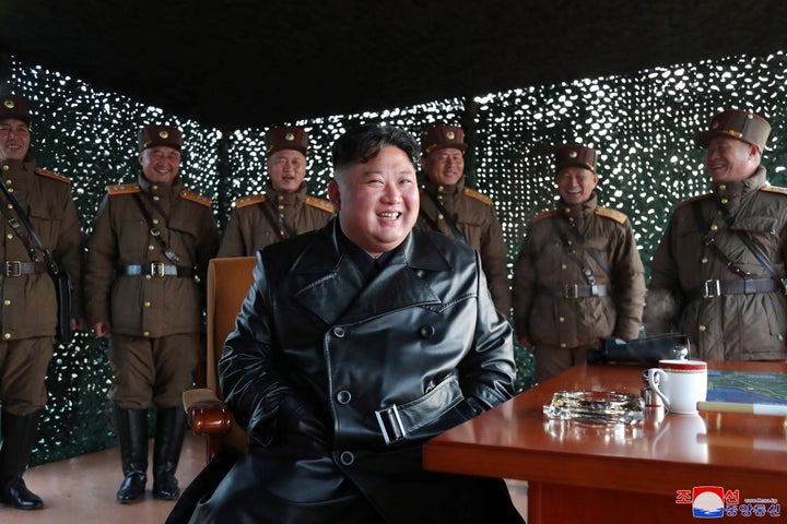 North Korean leader Kim Jong Un smiles after witnessing the firing of what was believed to be two short-range ballistic missiles on Saturday.