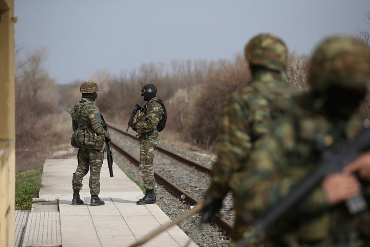 Greek army patrol at the train station of Kastanies village, near the Greek-Turkish border on Sunday, March 8, 2020. Thousands of migrants headed for Turkey's land border with EU member Greece after Turkish President Recep Tayyip Erdogan's government announced earlier this month that it would no longer prevent migrants and refugees from crossing over to EU countries. (AP Photo/Giannis Papanikos)