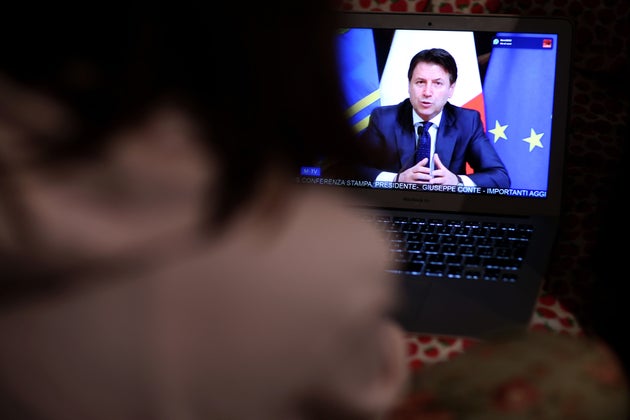 ROME, ITALY - MARCH 21: A girl watches tv as Italian Prime Minister Giuseppe Conte announces the shut...