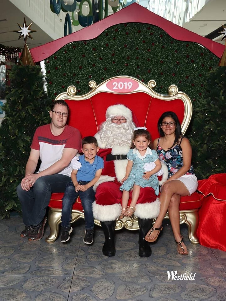 Silvia and Adam McIntosh pose with their two children ― Mateo, 5 and Amelia, 3 ― in their 2019 Christmas family photo. Now the children are back home in Melbourne while their mum and dad are stuck in Central America.