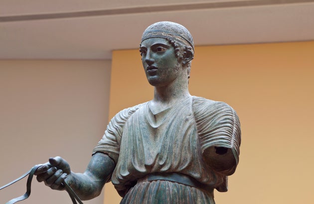 Charioteer statue located at Delphi museum in Greece