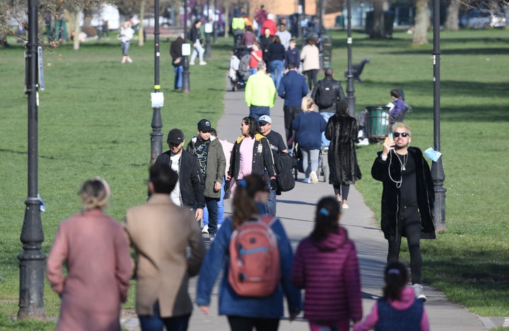 Pedestrians use a path across Clapham Common in south London.