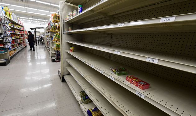 Empty shelves are seen in the food section of a supermarket store in Alhambra, California on March 15, 2020 as the coronavirus pandemic has affected over 3,100 Americans in 49 states, sparking a buying frenzy. (Photo by Frederic J. BROWN / AFP) (Photo by FREDERIC J. BROWN/AFP via Getty Images)