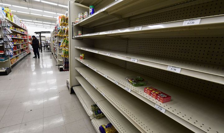 Empty shelves are seen in the food section of a supermarket store in Alhambra, California on March 15, 2020 as the coronavirus pandemic has affected over 3,100 Americans in 49 states, sparking a buying frenzy. (Photo by Frederic J. BROWN / AFP) (Photo by FREDERIC J. BROWN/AFP via Getty Images)