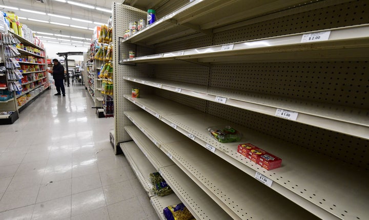 Empty shelves are seen in the food section of a supermarket store in Alhambra, California on March 15, 2020 as the coronavirus pandemic has affected over 3,100 Americans in 49 states, sparking a buying frenzy. (Photo by Frederic J. BROWN / AFP) (Photo by FREDERIC J. BROWN/AFP via Getty Images)